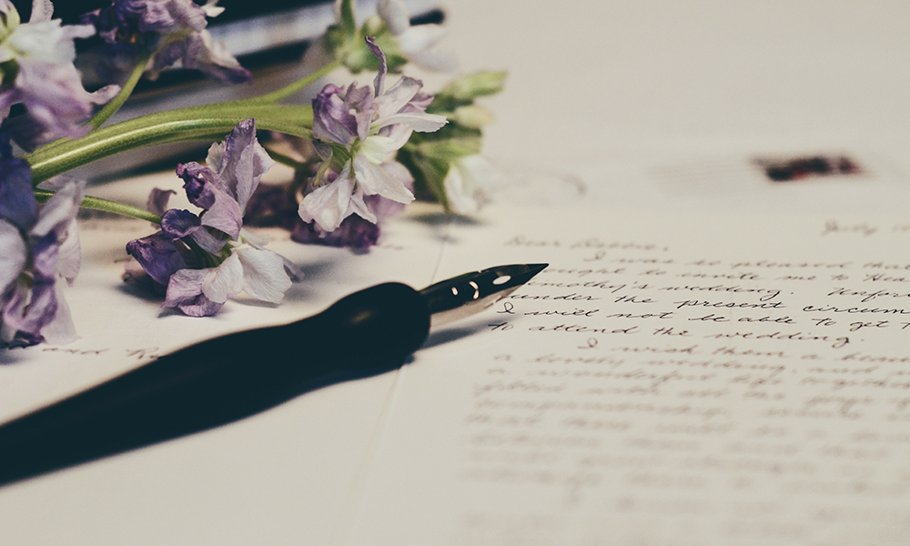 Pen and paper with flowers