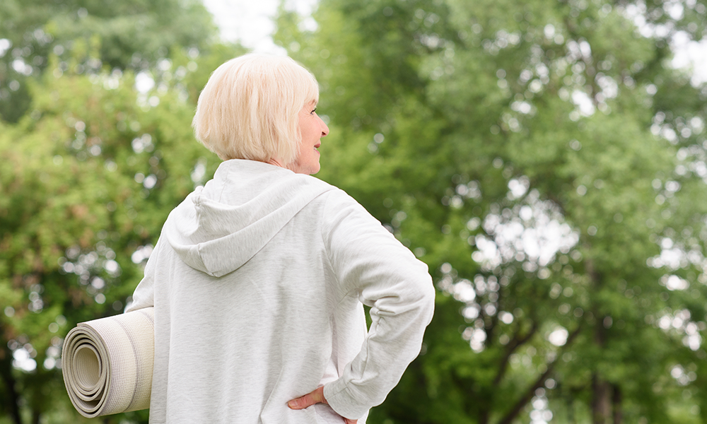 Older woman getting ready to workout on vacation