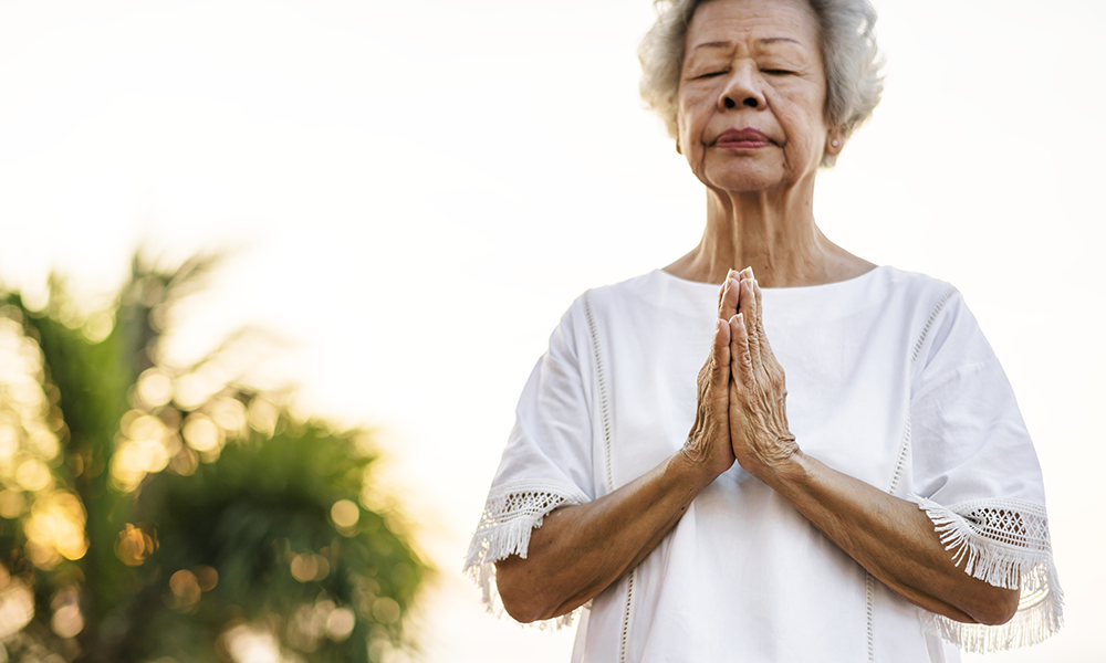 Woman practicing yoga on vacation