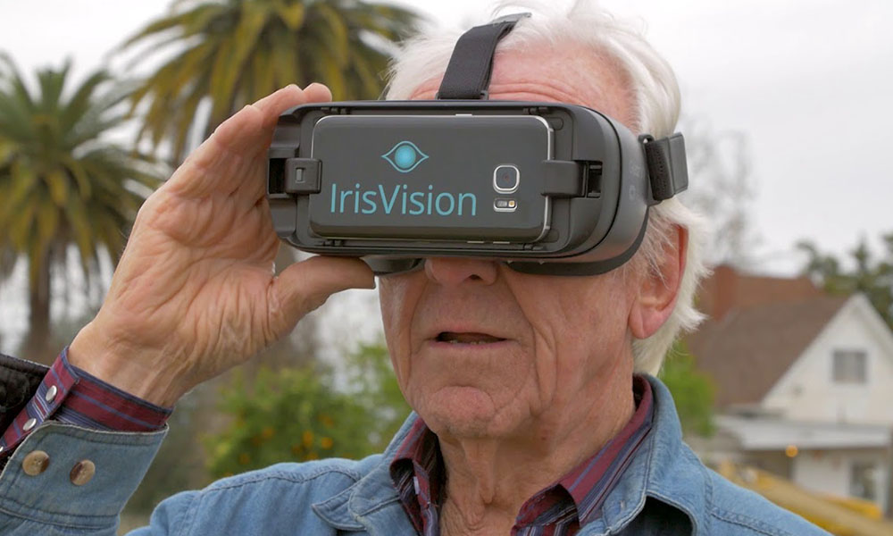 Senior Man Using Vision Enhancement Technology, IrisVision 